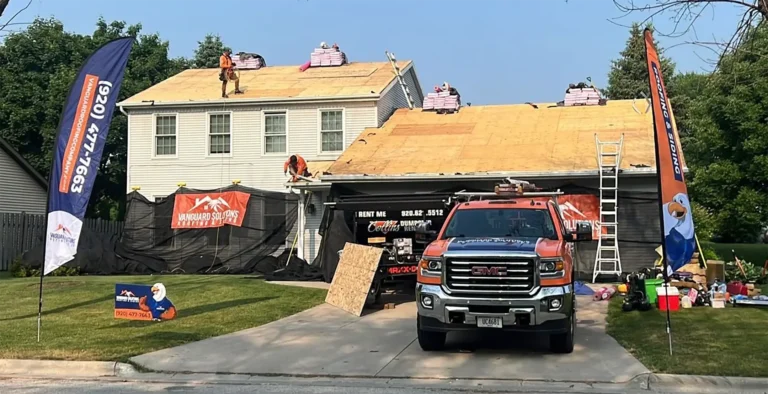 hero-vangaurd truck outside house-vanguard roofing and siding-stevens point