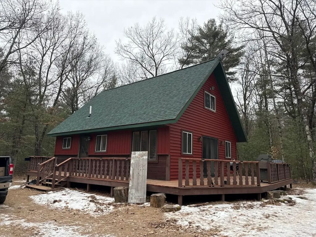 siding rothschild Vanguard Roofing green roof winter time red siding
