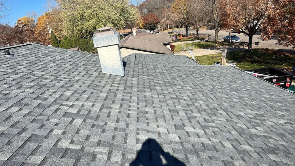 A newly installed grey shingle roof