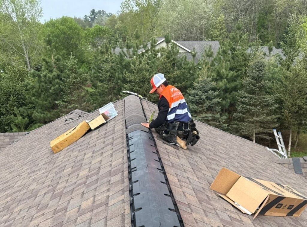 Vanguard team member working on a roof