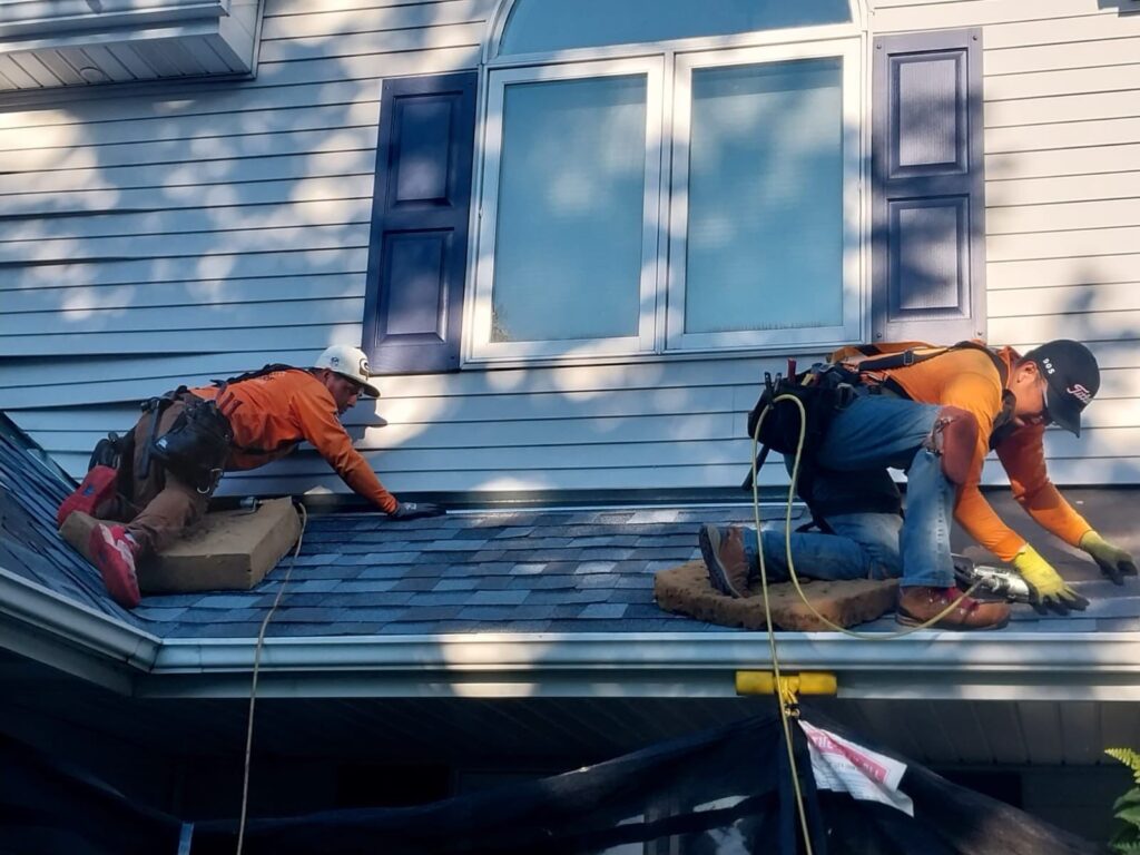 Vanguard team working on a roof