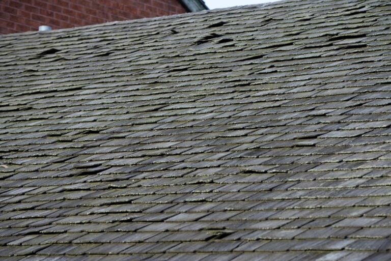 old roof with loose shingles, Signs Your Old Roof Needs Attention
