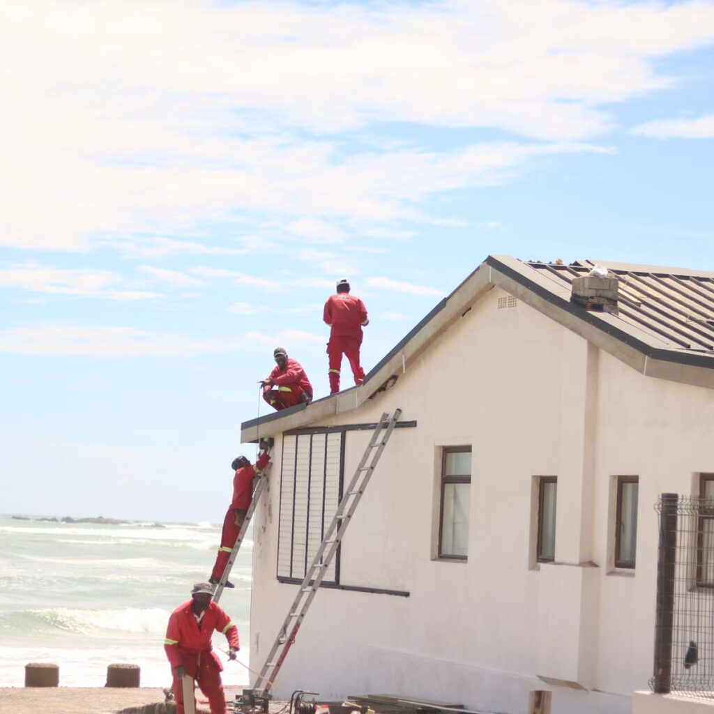 Roofing professionals working on a residential roof for a trusted roofing company in Downers Grove, IL