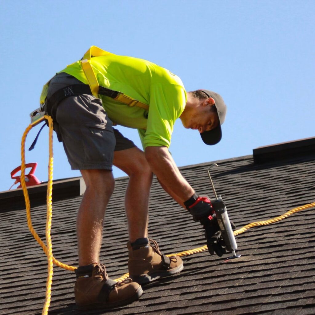 Roofing professional installing shingles on a home for an experienced roofing company in Naperville, IL