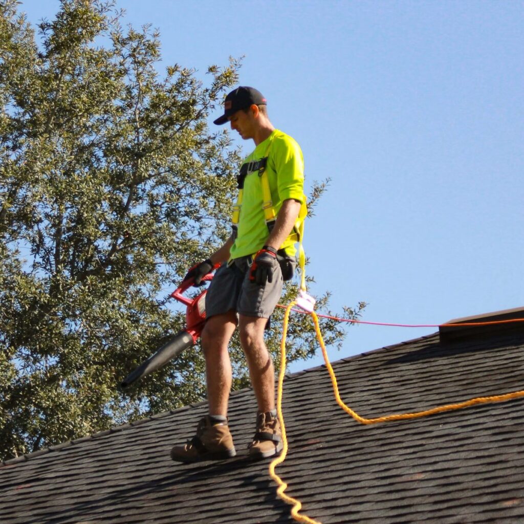 Roofing professional working on a shingle roof for a reputable roofing company in Elmhurst, IL