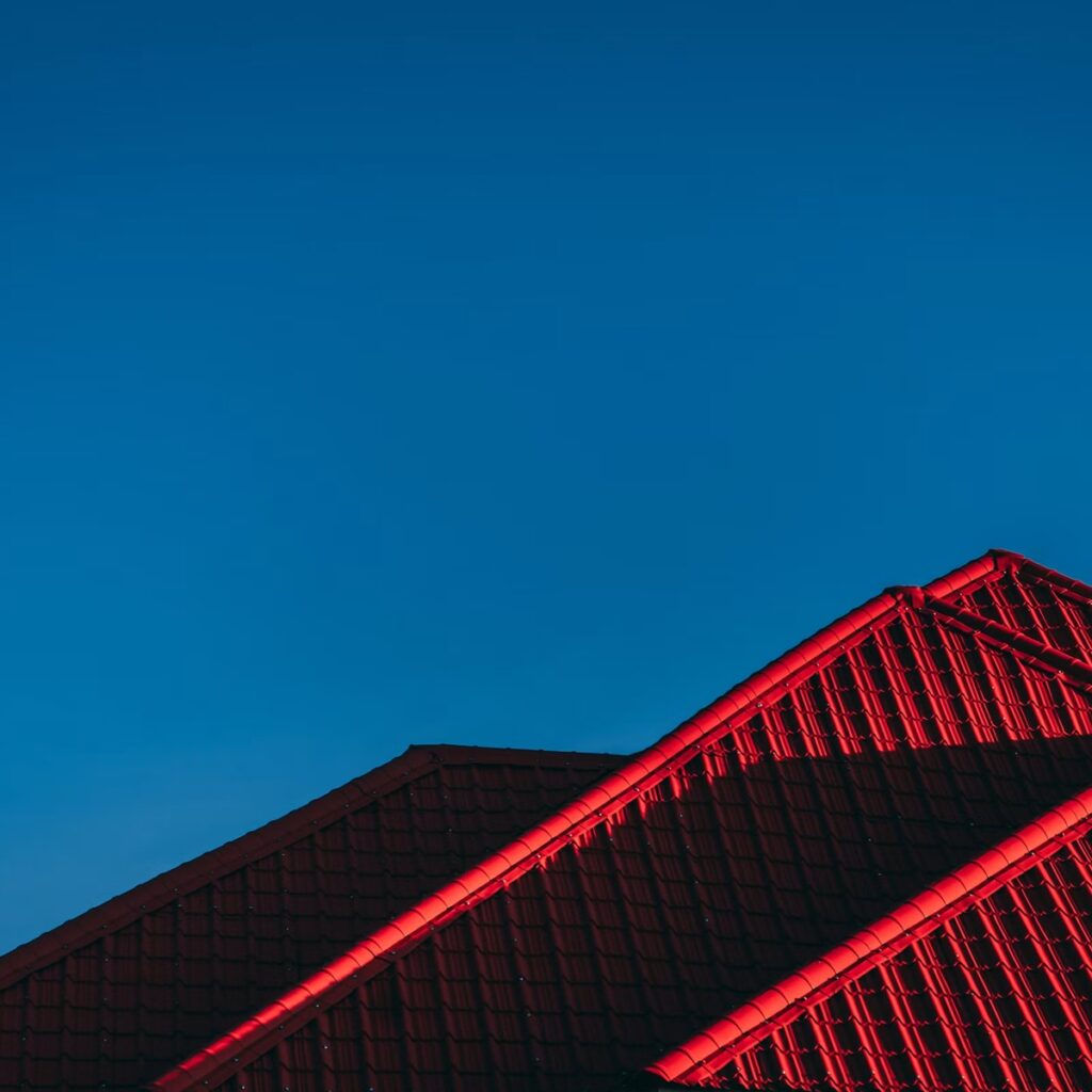 Residential tile roofing under dramatic lighting for a dependable roofing company in Western Springs, IL